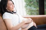 Pregnant Woman Using Stethoscope Stock Photo