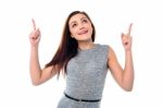 Amused Young Girl In Sleeveless Dress Stock Photo