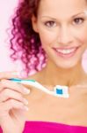 Smiling Woman And Teeth Brush Stock Photo