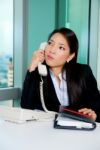 Bored Girl Talking Over Phone Stock Photo