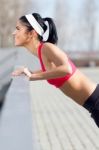 Young Woman Doing Push-ups Stock Photo