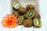 Tasty Kiwi Fruits Isolated On A White Wooden Background Stock Photo