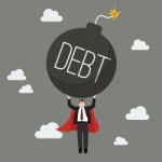 Businessman Superhero Carry Debt Bomb Stock Photo