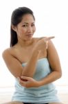 Young Female In Towel Indicating Aside Stock Photo