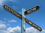 Yesterday Now Tomorrow Signpost Stock Photo