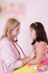 Doctor Examining Girl Stock Photo