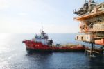 Supply Boat Transfer Cargo To Oil And Gas Industry Stock Photo