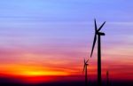 Wind Turbine Silhouette On Colorful Sunset Stock Photo