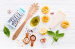 The Ingredients For Homemade Pesto Pasta On White Wooden Backgro Stock Photo