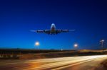 Flying Passenger Jet Plane Above Traffic Light On Express Ways U Stock Photo