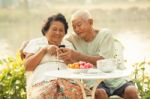 Senior Couple Using The Mobile Phone Stock Photo