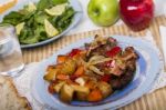Oven Baked Meat With Potatoes, And Watercress Salad Stock Photo