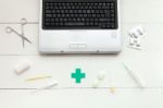 Laptop Computer And Retro Medical Instruments Stock Photo