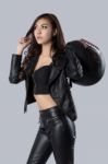 Beautiful Female Biker Wearing A Leather Jacket Stock Photo