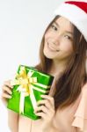 Santa Girl Holding Christmas Gift Stock Photo