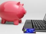 Piggy At Computer Shows Banking On Laptop Stock Photo