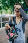 Woman Tired Of Somethings With Hand On Her Head Looking At Mobil Stock Photo