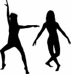 Silhouette Of Dancing Women Stock Photo