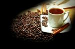 Hot Coffee With Beans On The Table Stock Photo