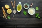 The Ingredients For Green Pesto Sauce On Dark Wooden Background Stock Photo