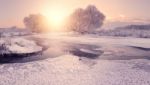 Sun Rising Above Icy Lake. Ice Pattern On Lake Stock Photo