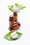 Essential Oil With Jasmine  Flower On White Background Stock Photo