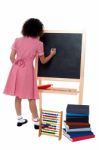 Rear View Of School Girl In Maths Class Stock Photo