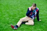 Happy Young Man Talking On Mobile Phone Stock Photo