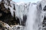 View Of Skogafoss Waterfall In Winter Stock Photo