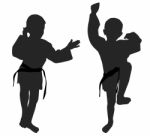 Silhouettes Of Two Little Boys Stock Photo