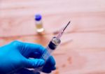 Hand Holding Syringe With  Needle Stock Photo