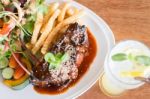 Delicious Barbecued Ribs And Lemon Soda Drink Stock Photo