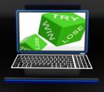 Win, Try, Lose Dices On Laptop Shows Gambling Stock Photo