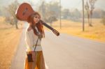 Hippie Girl Hitchhiking Stock Photo