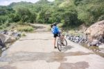 Cyclist On The Road Near Guangololo In Honduras Stock Photo