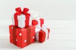 Christmas Gift Boxes On White Wood Table Stock Photo