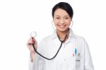 Female Physician Posing With Stethoscope Stock Photo