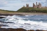 View Of Dunstanburgh Castle At Craster Northumberland Stock Photo