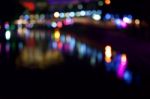 Without Objects, The City Lights And The Shadows In The Water Become The Background Stock Photo