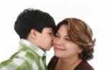 Little Boy Kiss His Mother Stock Photo