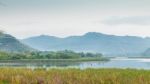 Mountain And Sky View Around Reservoir Stock Photo