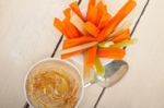 Fresh Hummus Dip With Raw Carrot And Celery Stock Photo