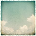 Clouds On A Textured, Vintage Paper Background Stock Photo