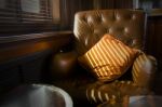 Brown Leather Sofa Chair Nearby Window Stock Photo