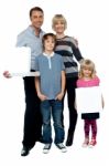 Family Of Four. Father And Daughter Holding Pizza Boxes Stock Photo