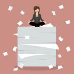 Business Woman Meditating On A Lot Of Documents Stock Photo