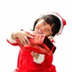 Little Girl Dressed As Santa Claus Stock Photo