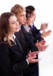 Colleagues Applauding During A Business Meeting Stock Photo