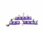 Miniature Worker Team Building Word Happy New Year On White Back Stock Photo