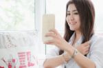 Attractive Asian Woman Make A Selfie With Her Smartphone Stock Photo